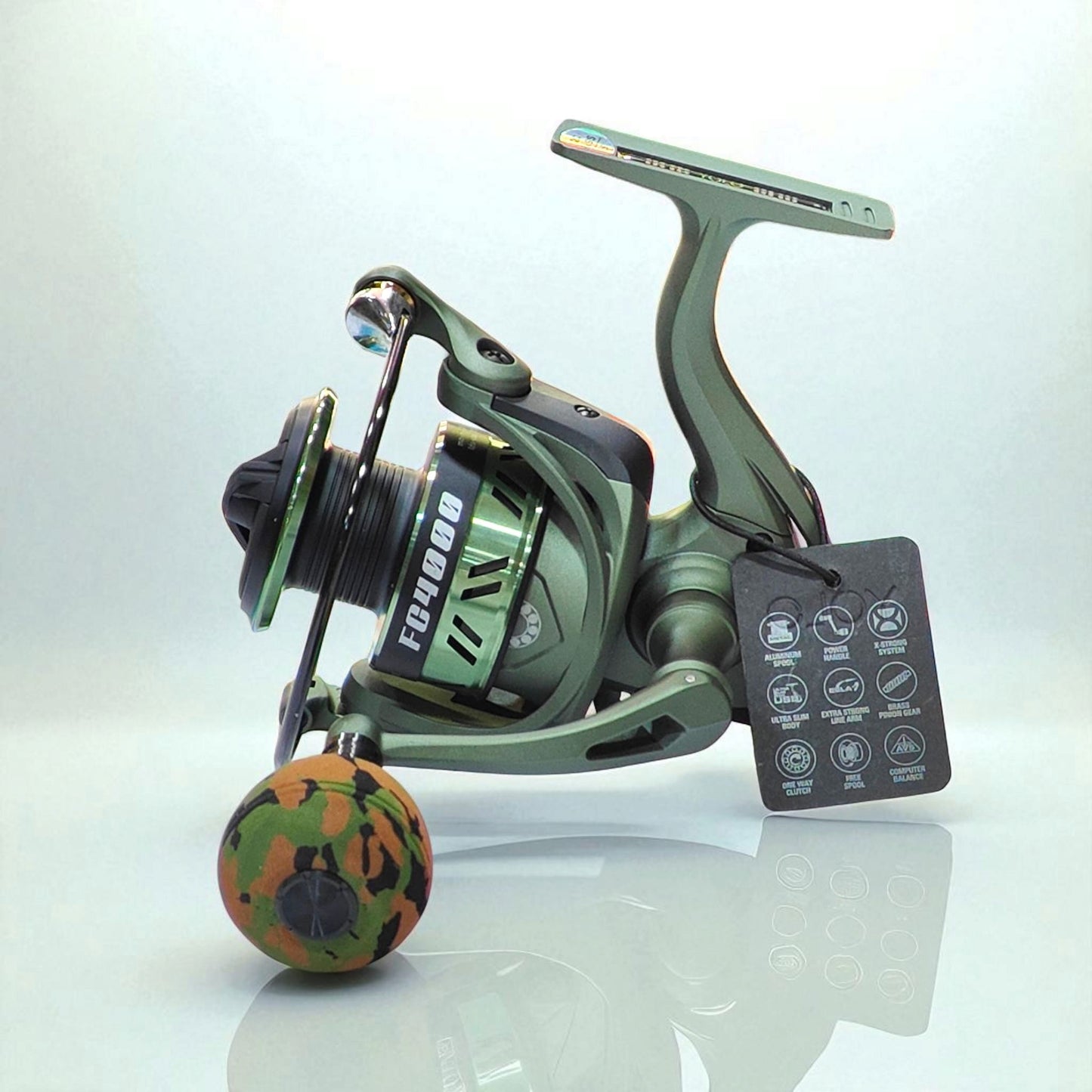FC4000 heavy duty spinning fishing reel in military green with camouflage EVA grip and precision drag system for freshwater and saltwater fishing