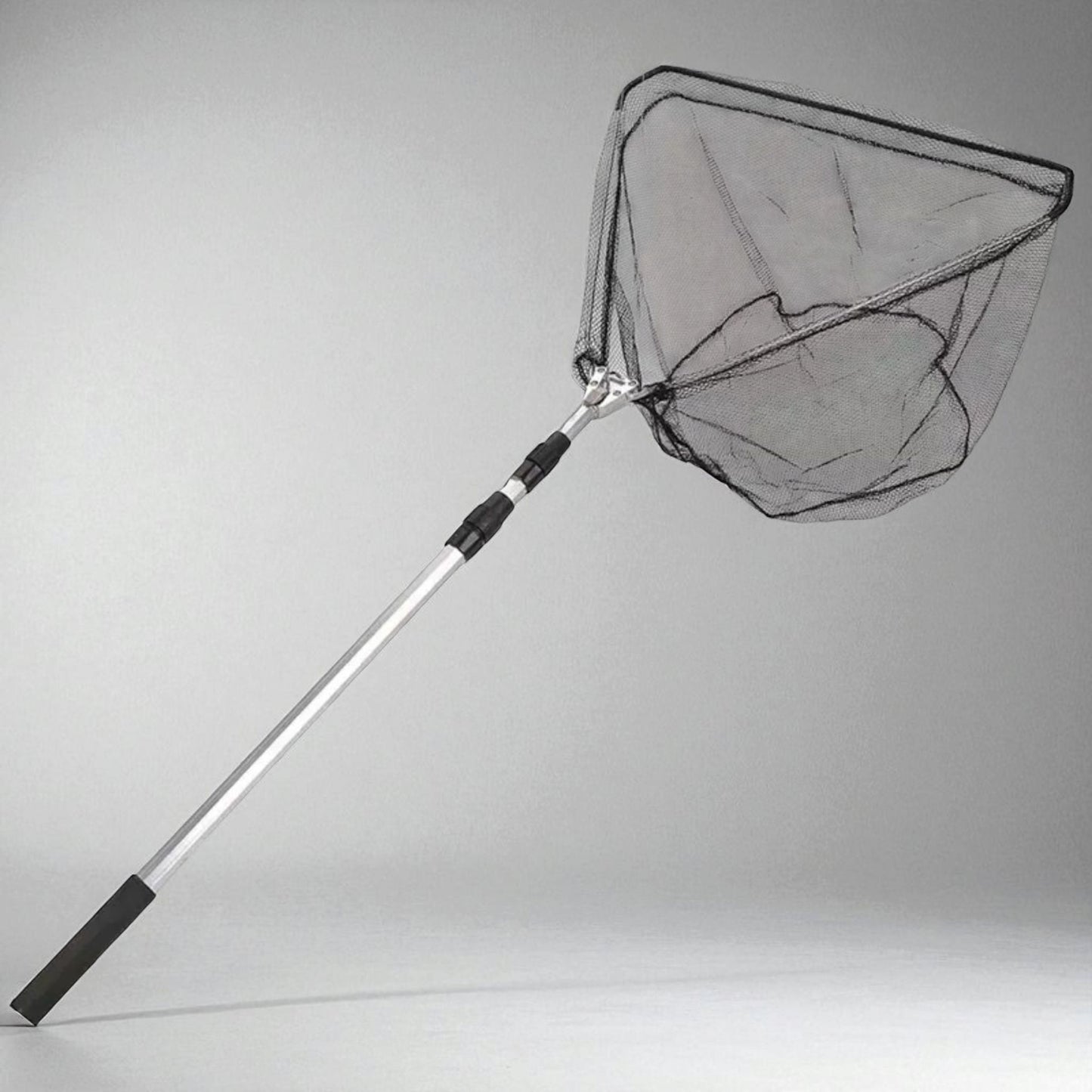 Portable and lightweight fish-catching net designed for easy transport, featuring collapsible handle and compact frame suitable for all anglers.