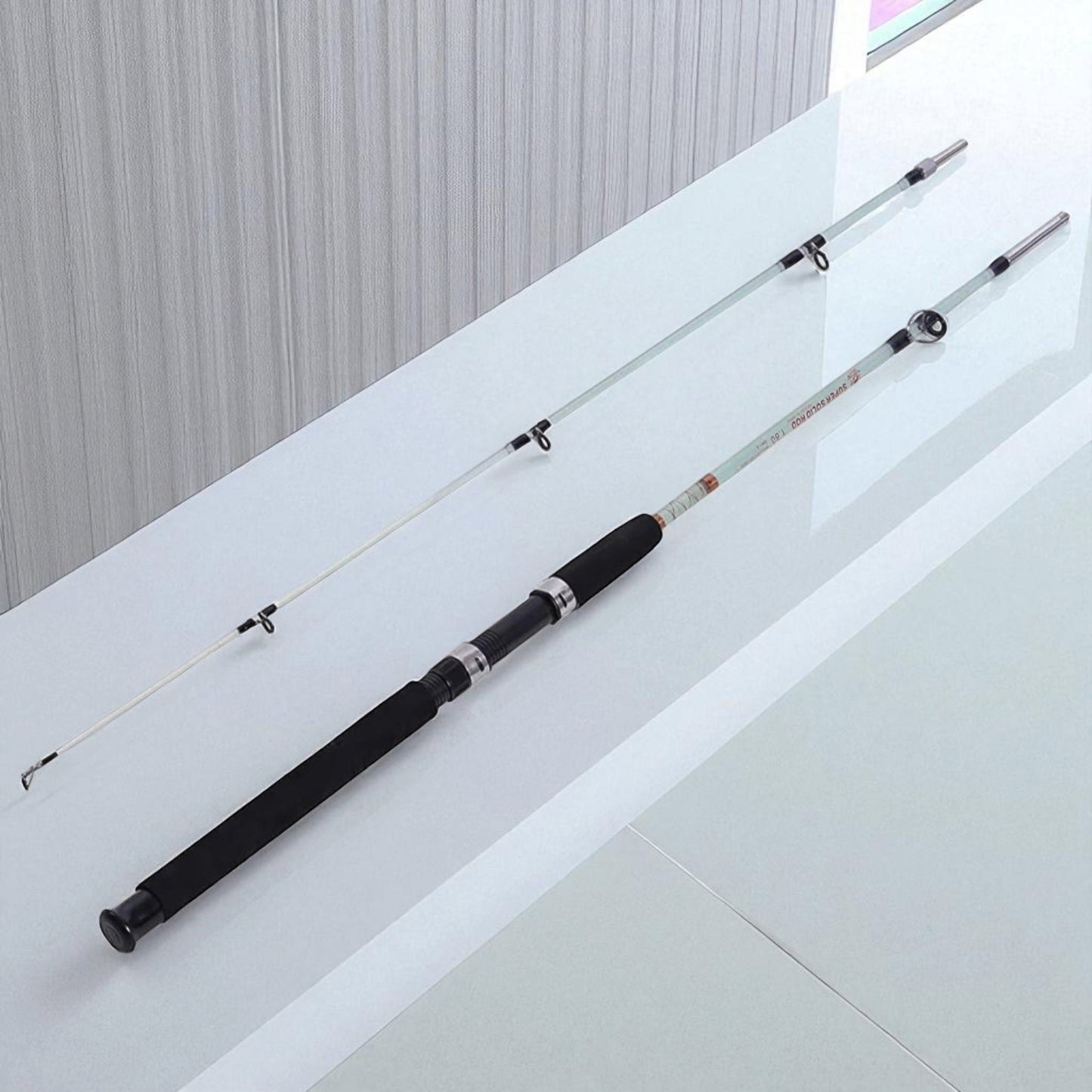Solid fibre spinning fishing rod with dual section screw joint, unbreakable solid glass construction, lightweight yet heavy-duty design, ideal for freshwater and saltwater fishing, available in 6ft, 7ft, 8ft, and 9ft sizes, designed for strength, durability, and smooth casting performance.