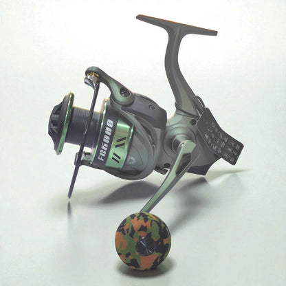 FC6000 heavy duty spinning fishing reel in military green with camouflage EVA grip, high drag power and durable build for freshwater and saltwater anglers
