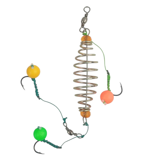 Close-up of a spring feeder fishing rig with three sharp fishing hooks, each baited with bright colored foam balls (yellow, green, and orange) for freshwater fishing